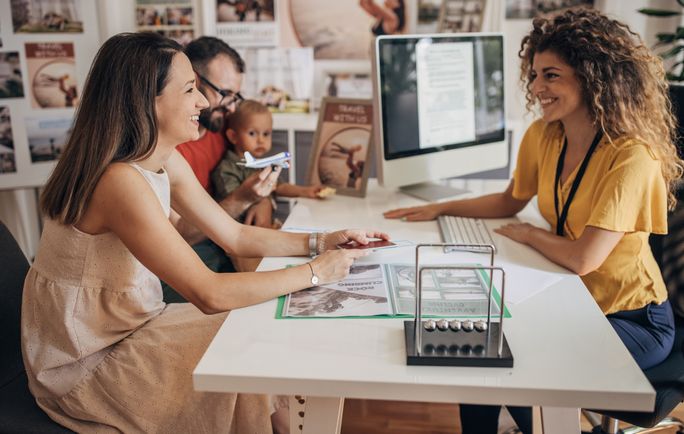 A family working with a travel advisor