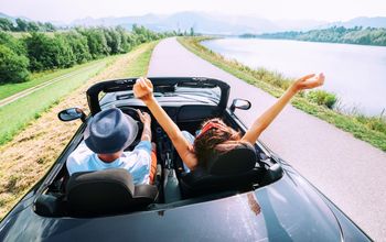 Couple in love ride in cabriolet car