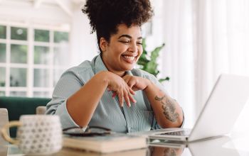 Travel advisor working at a laptop