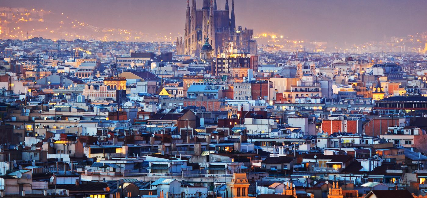 Image: Barcelona at night. (photo via kanuman / iStock / Getty Images Plus)