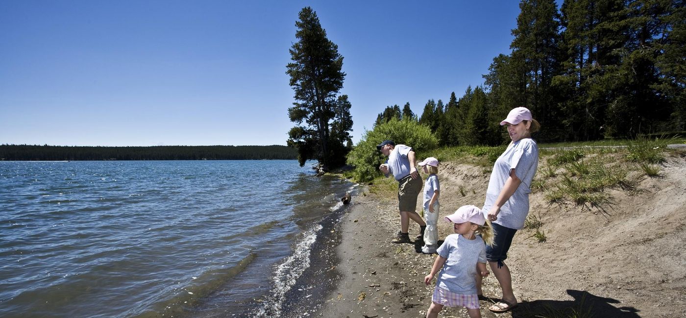 Image: Family on vacation in Yellowstone. (photo via BirdofPrey/E+)