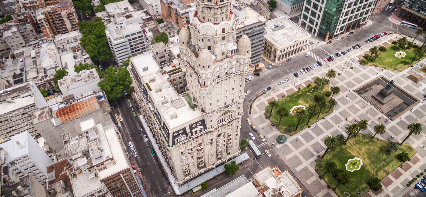 Image: Montevideo, Uruguay, aerial view of downtown buildings and Plaza Independencia square. (photo via rmnunes / iStock / Getty Images Plus)