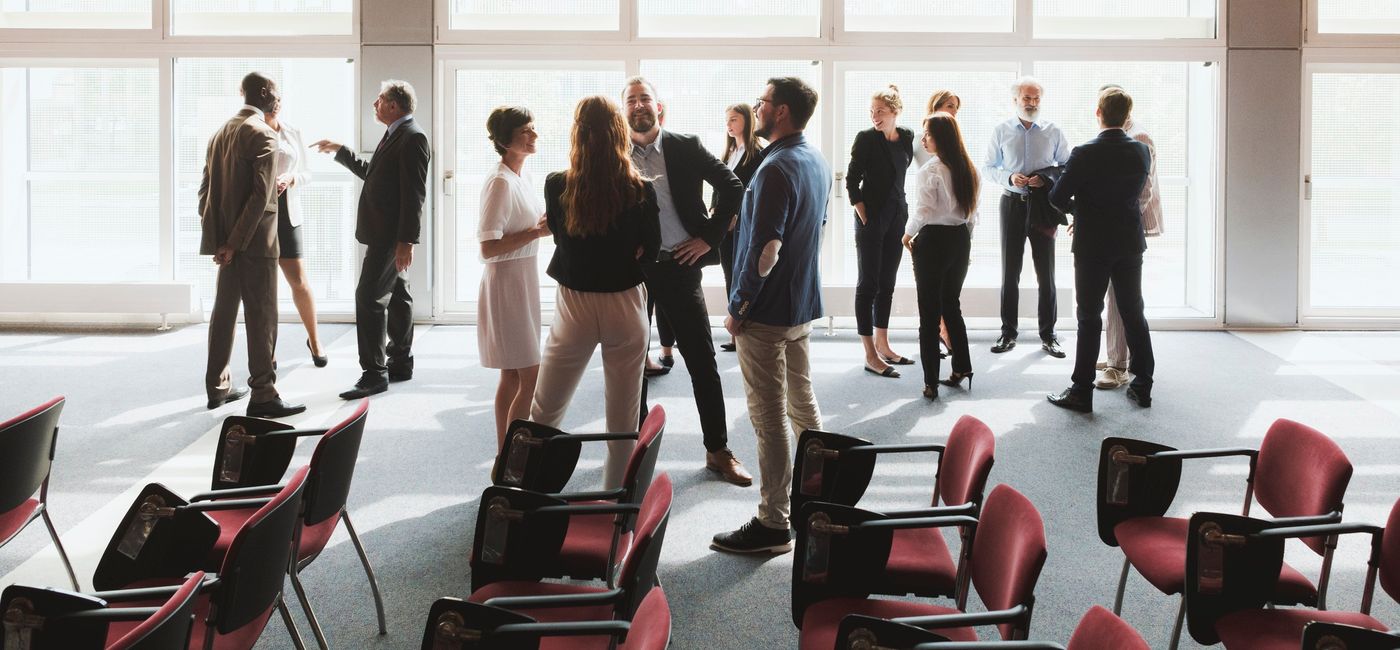 Image: Networking at an event. (photo via gremlin / getty images)