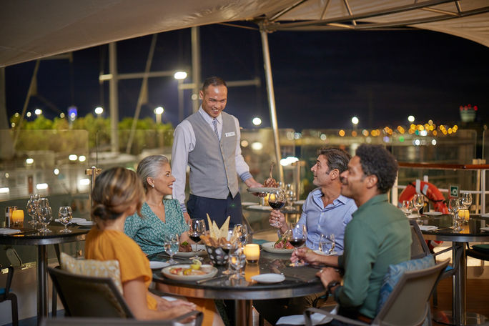 Outdoor dining at Candles restaurant onboard the Star Pride